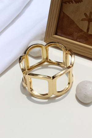 Echo Ridge Bracelet on a white surface with a blurred background