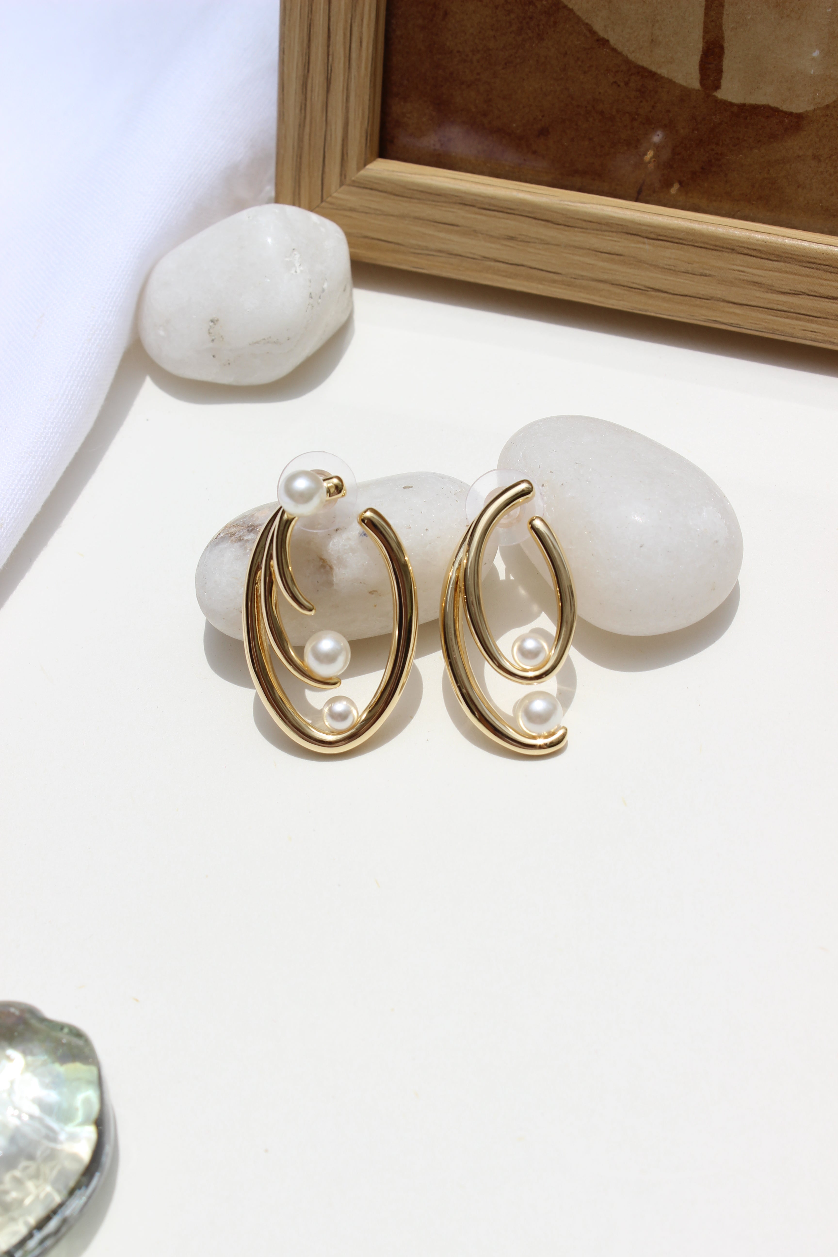 Not quite Twins Earrings on a light surface