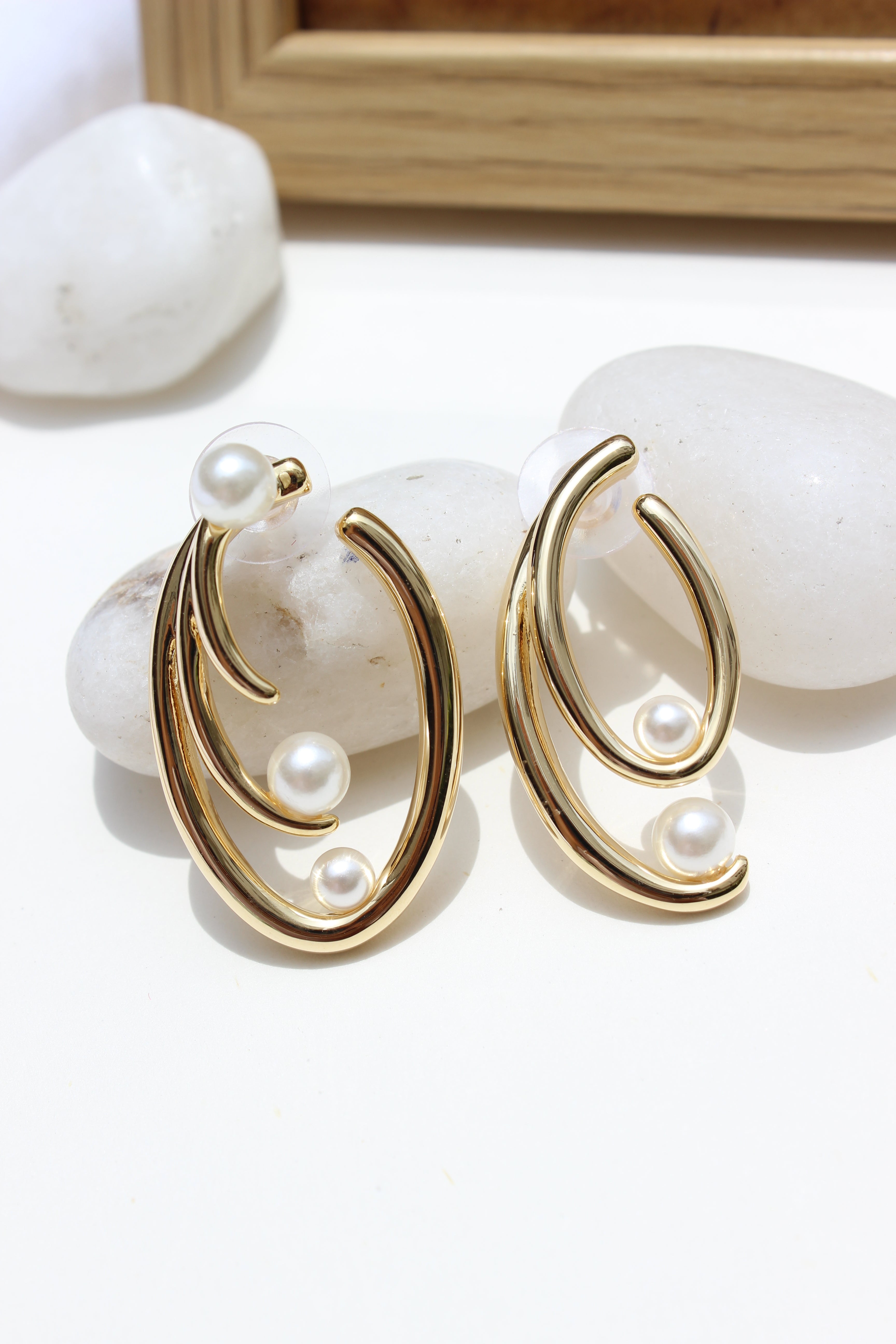 Not quite Twins Earrings on a white background