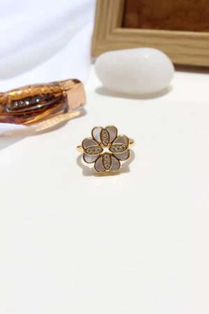 She of the Sea Ring on a white surface with a blurred background