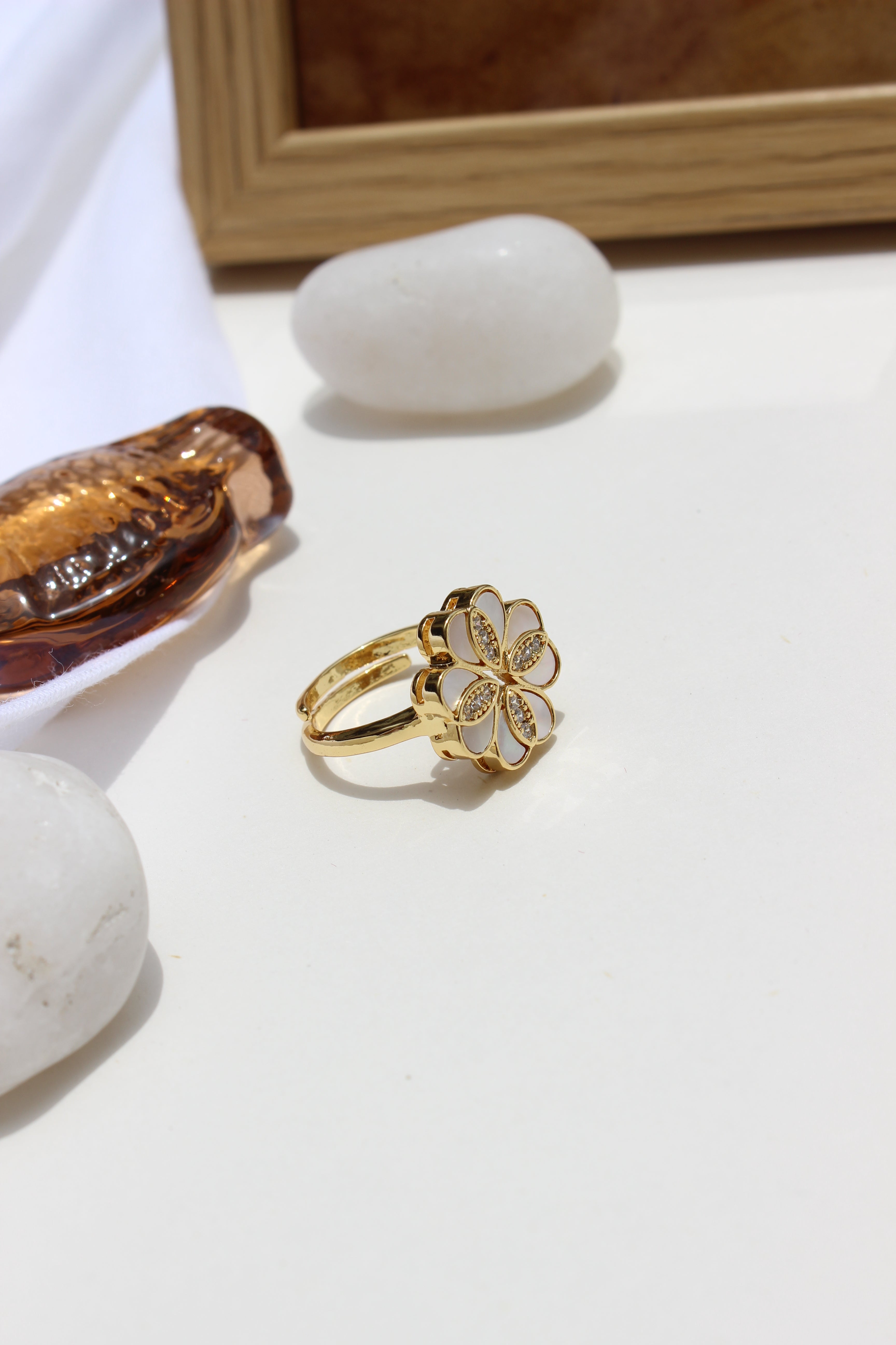 She of the Sea Ring with a white stone on a white surface
