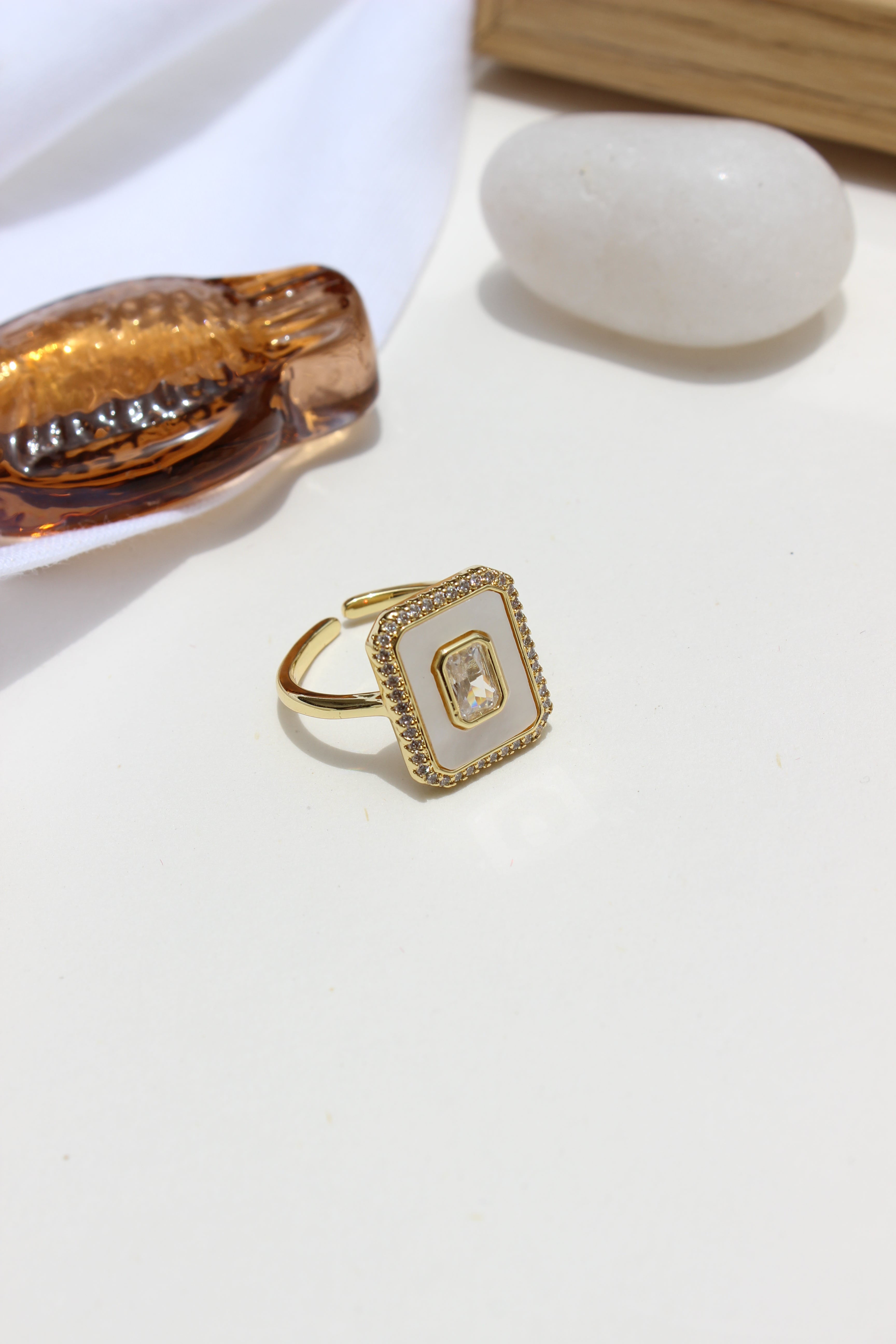 Moonborn Ring with a gemstone on a white surface