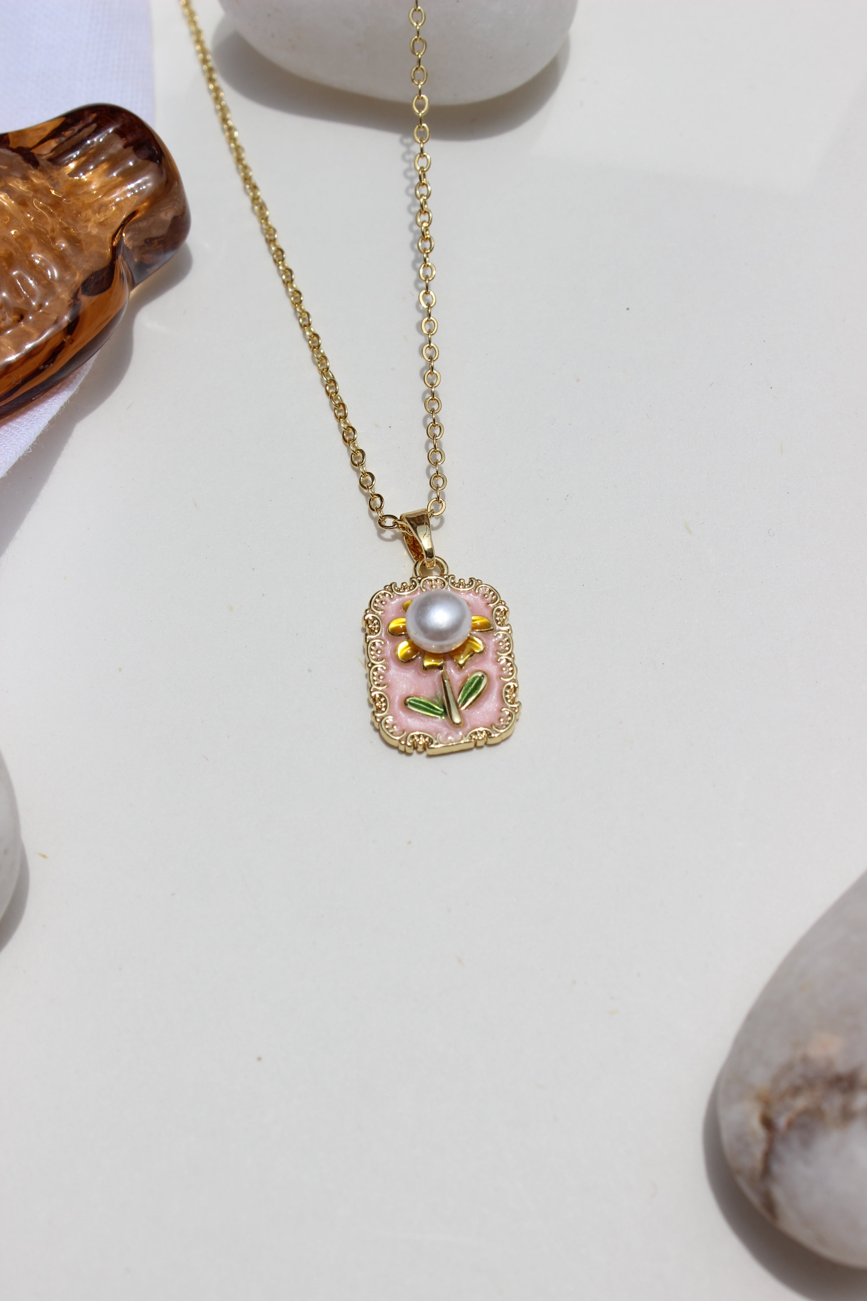 Petal of the Ocean Pendant Necklace on a grey background