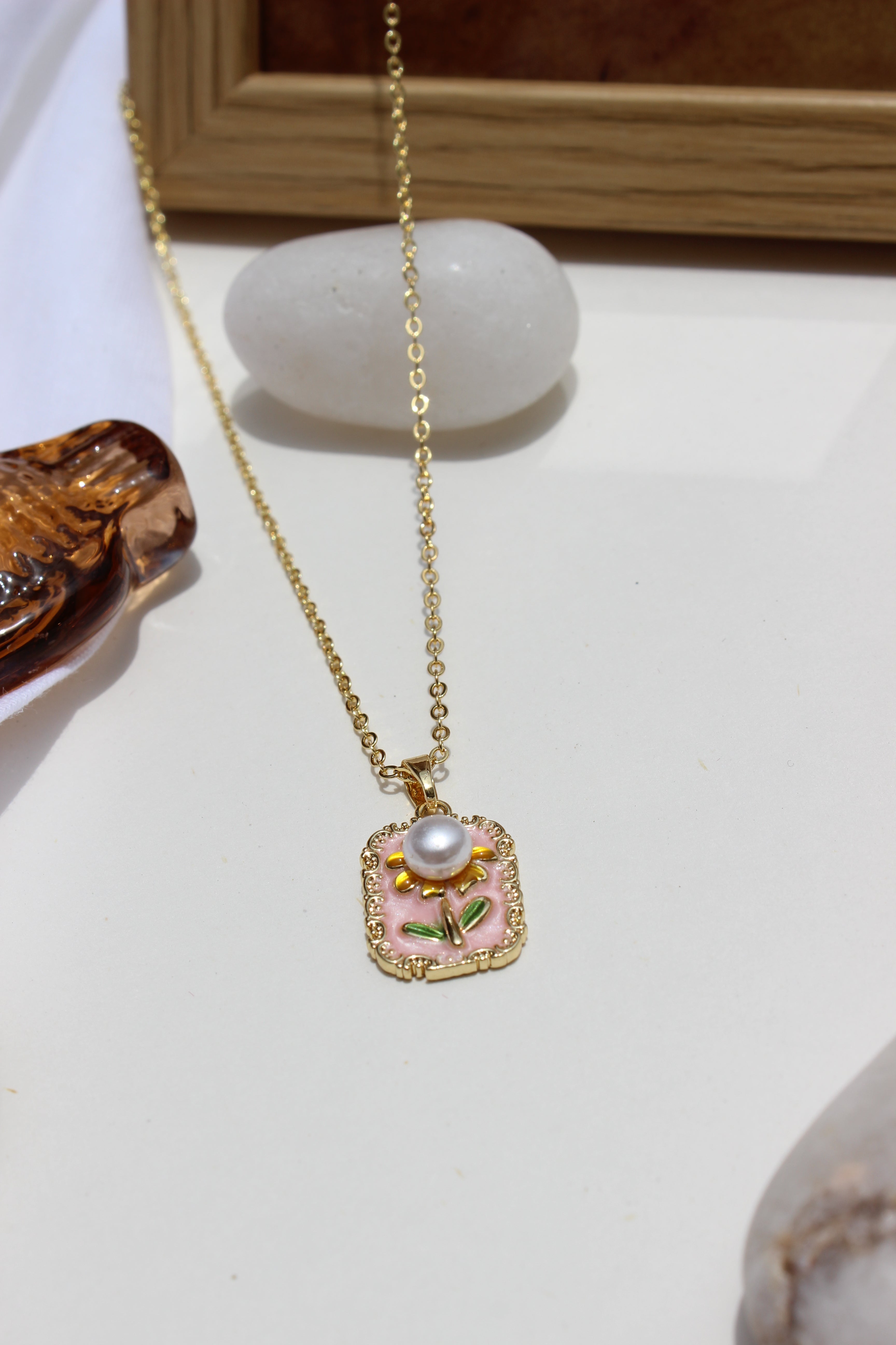 Petal of the Ocean Pendant Necklace on a white surface