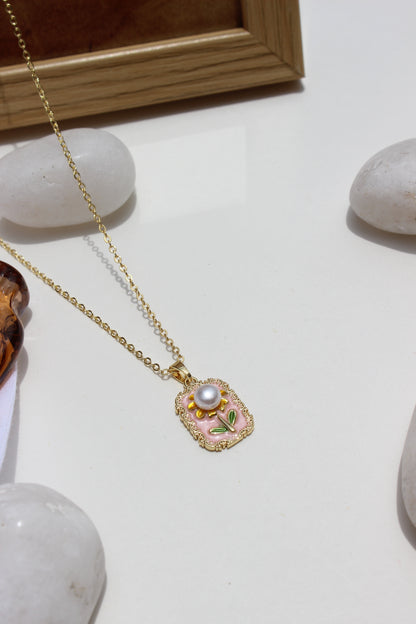 Petal of the Ocean Pendant Necklace with a pearl-like bead on a light background