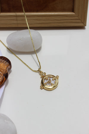 Whitespell Pendant Necklace on a white surface