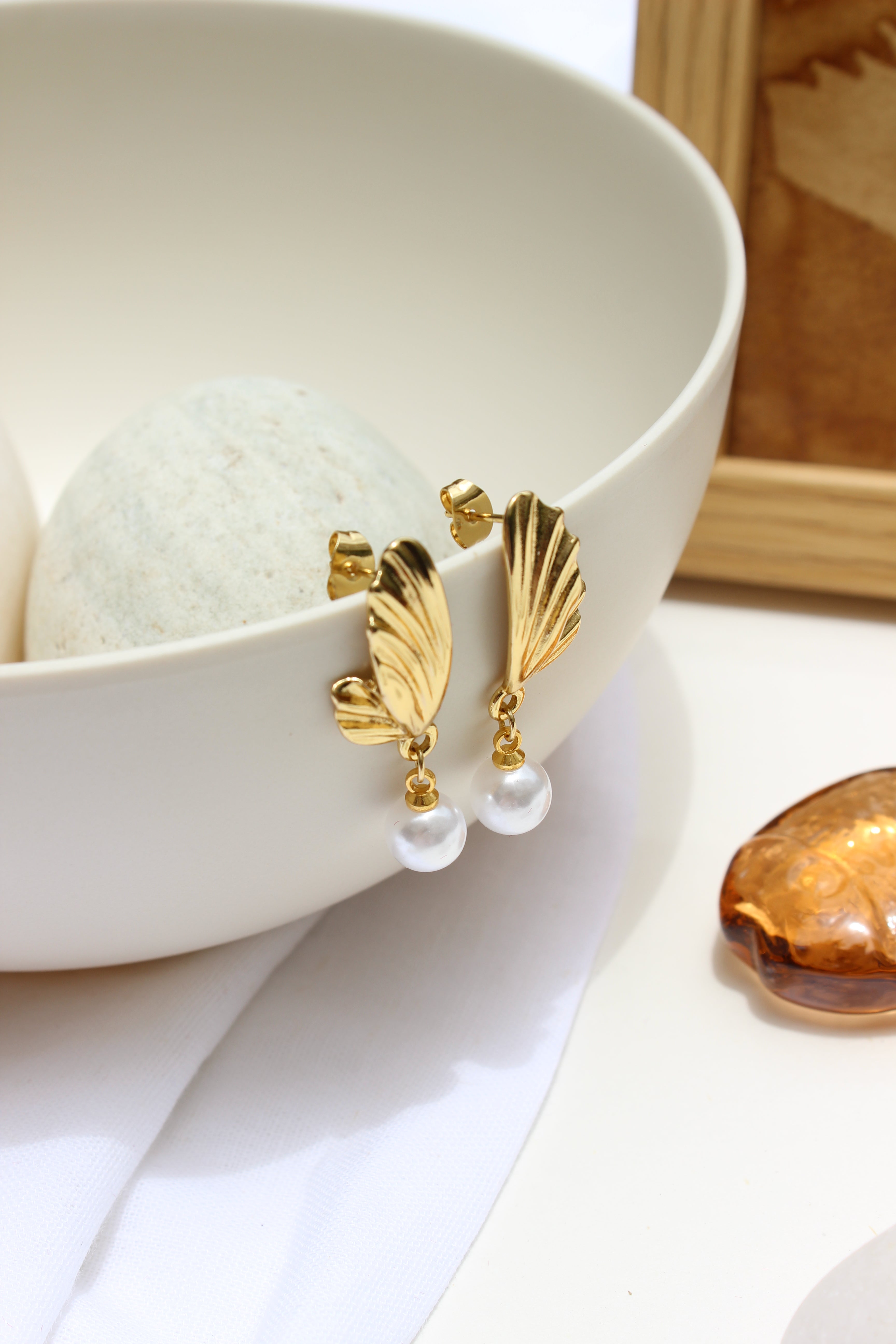 Lunar Drip Earrings on a white dish