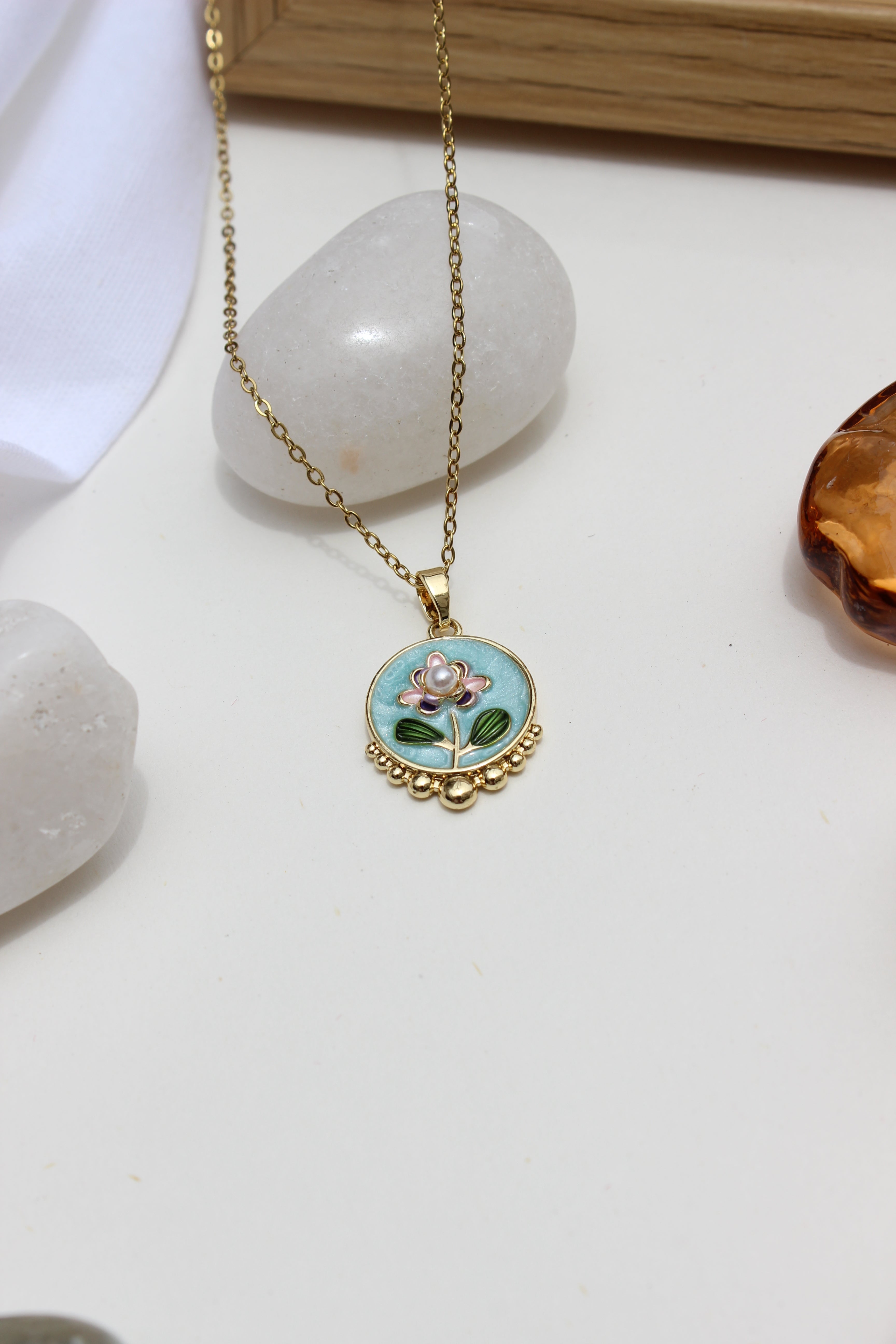 Skyflower Pendant Necklacet on a white surface