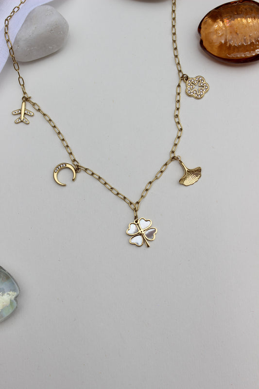 Where She Wanders Charm Necklace on a light gray background