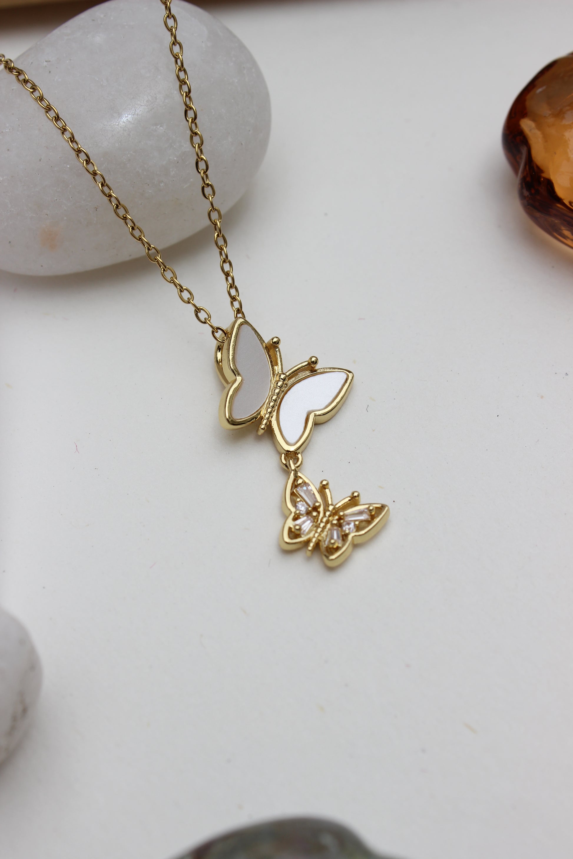 Clarisee Pendant Necklace on white stone  