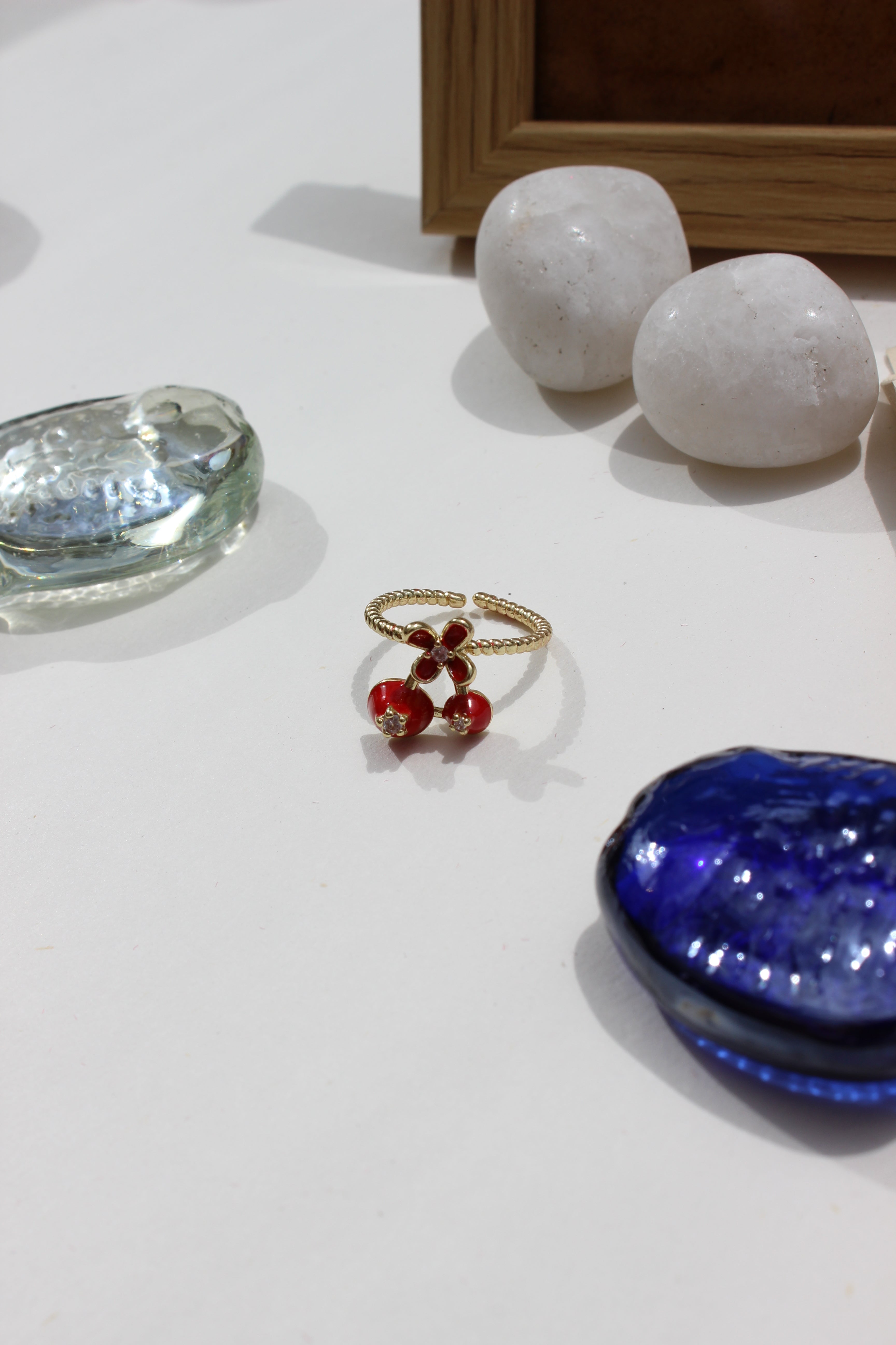 Kiss & Cherry Ring on a white surface