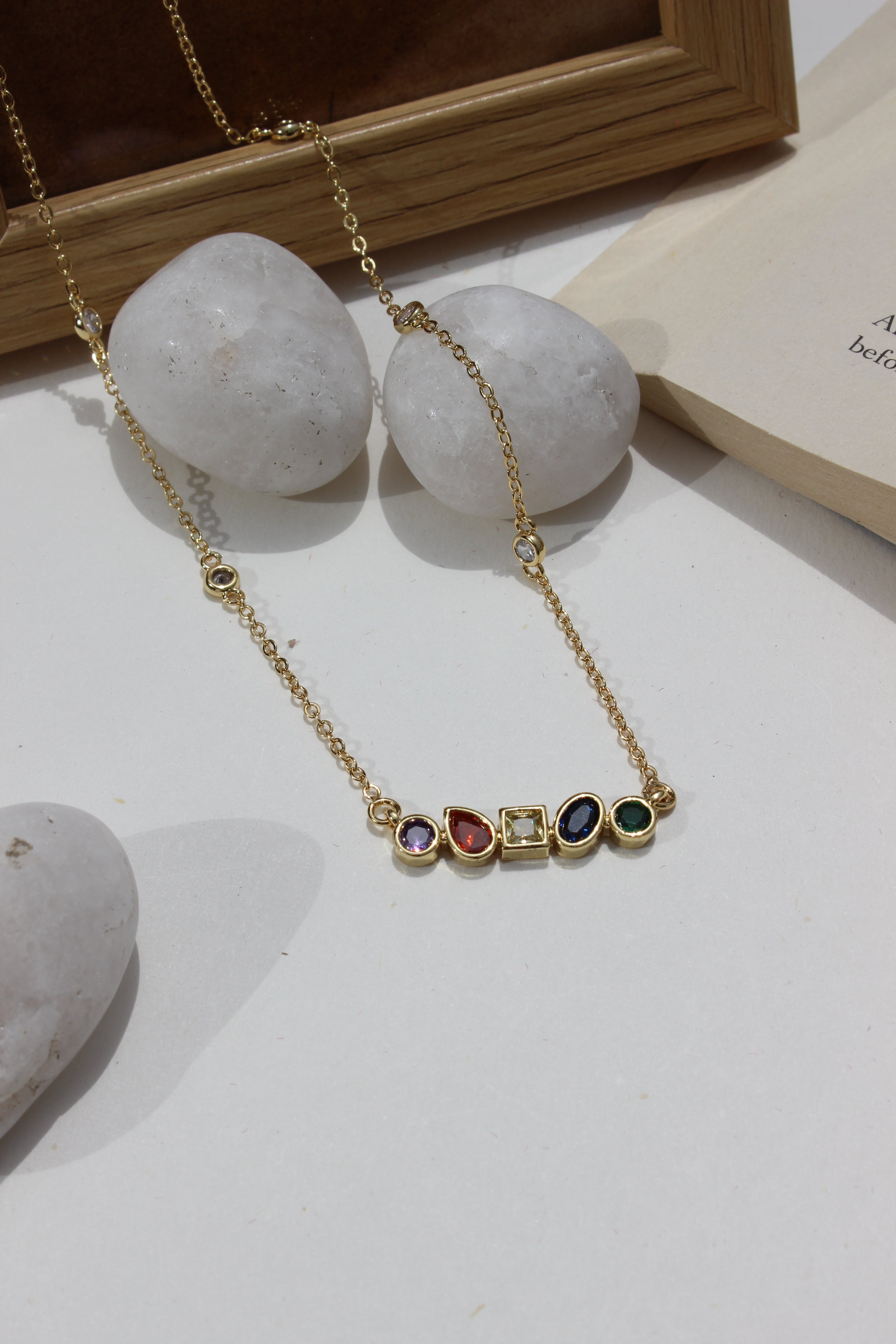 Carry Light Pendant Necklace on a white surface