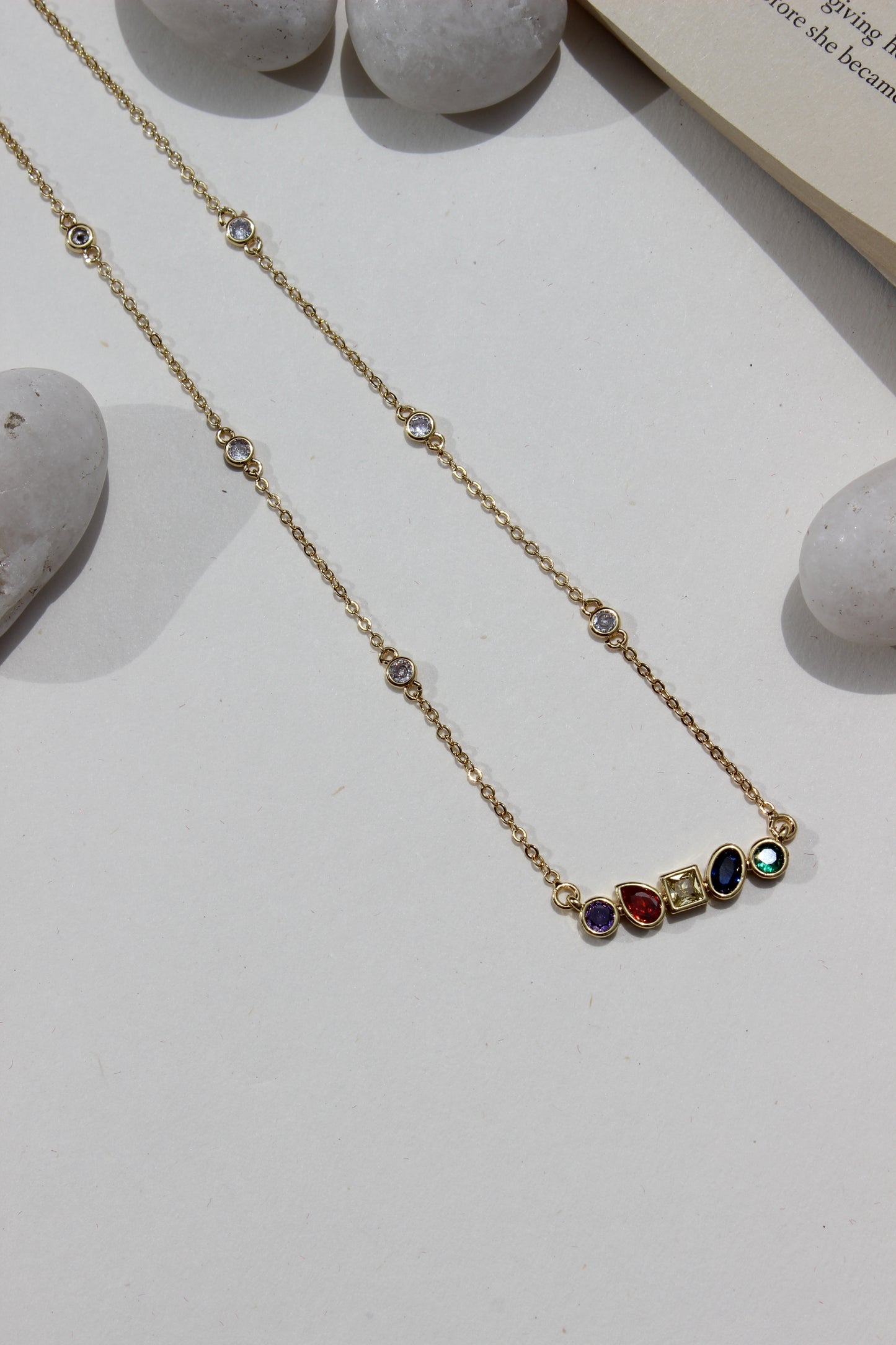 Carry Light Pendant Necklace on a light surface