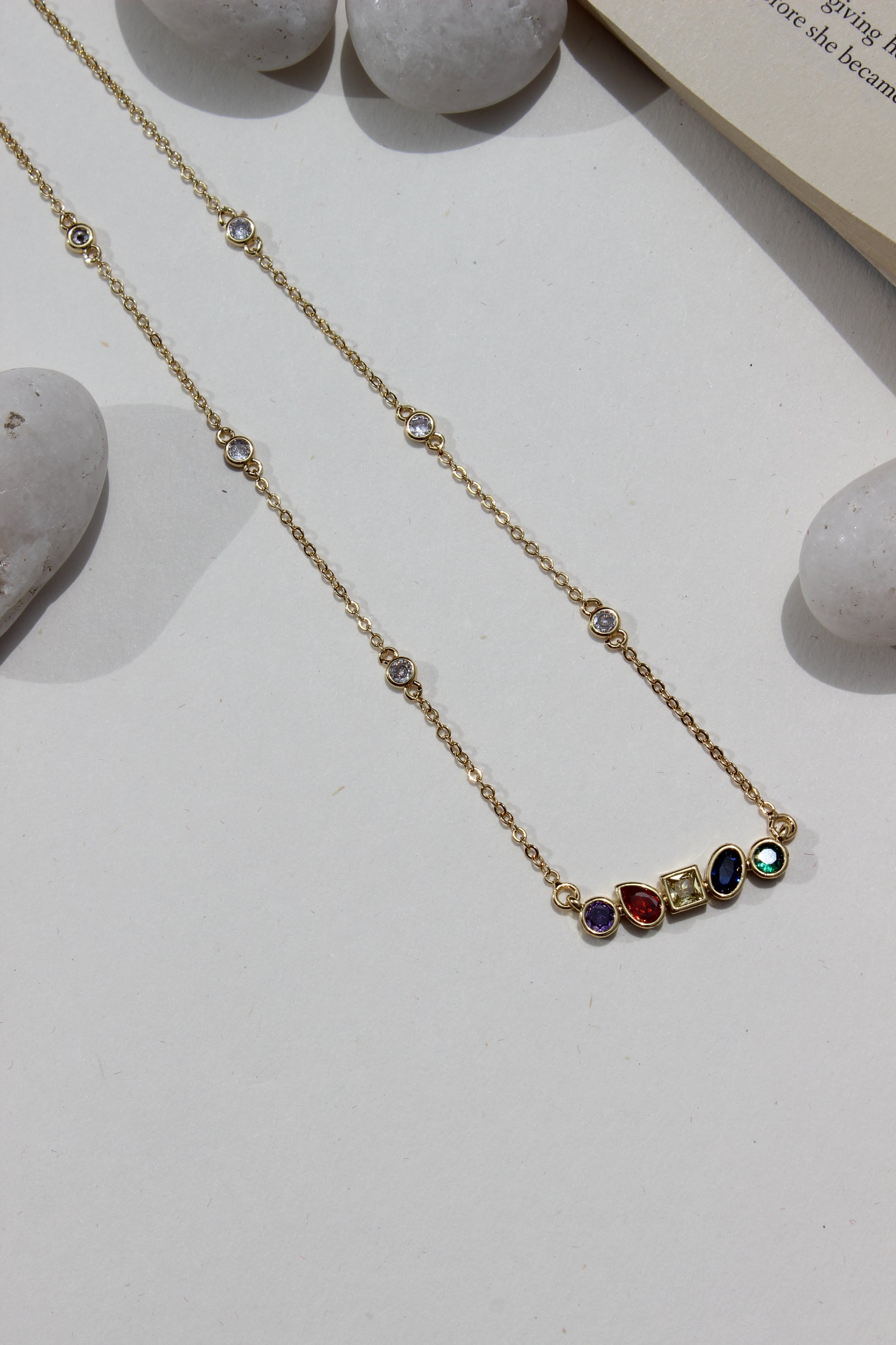 Carry Light Pendant Necklace on a light surface