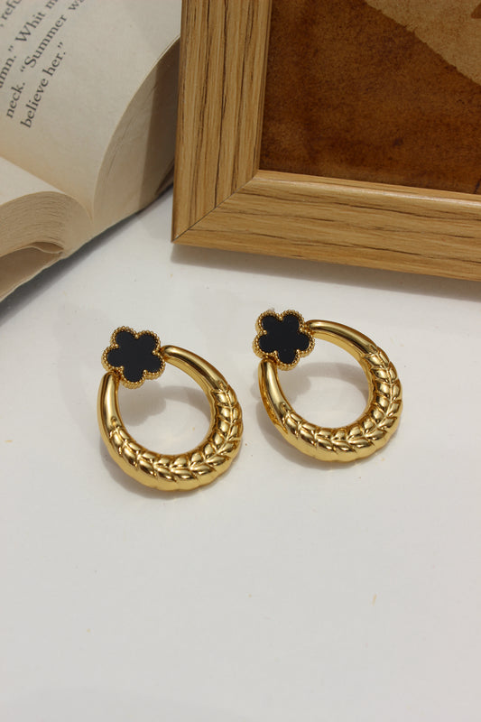 Orbella Earrings on a white surface