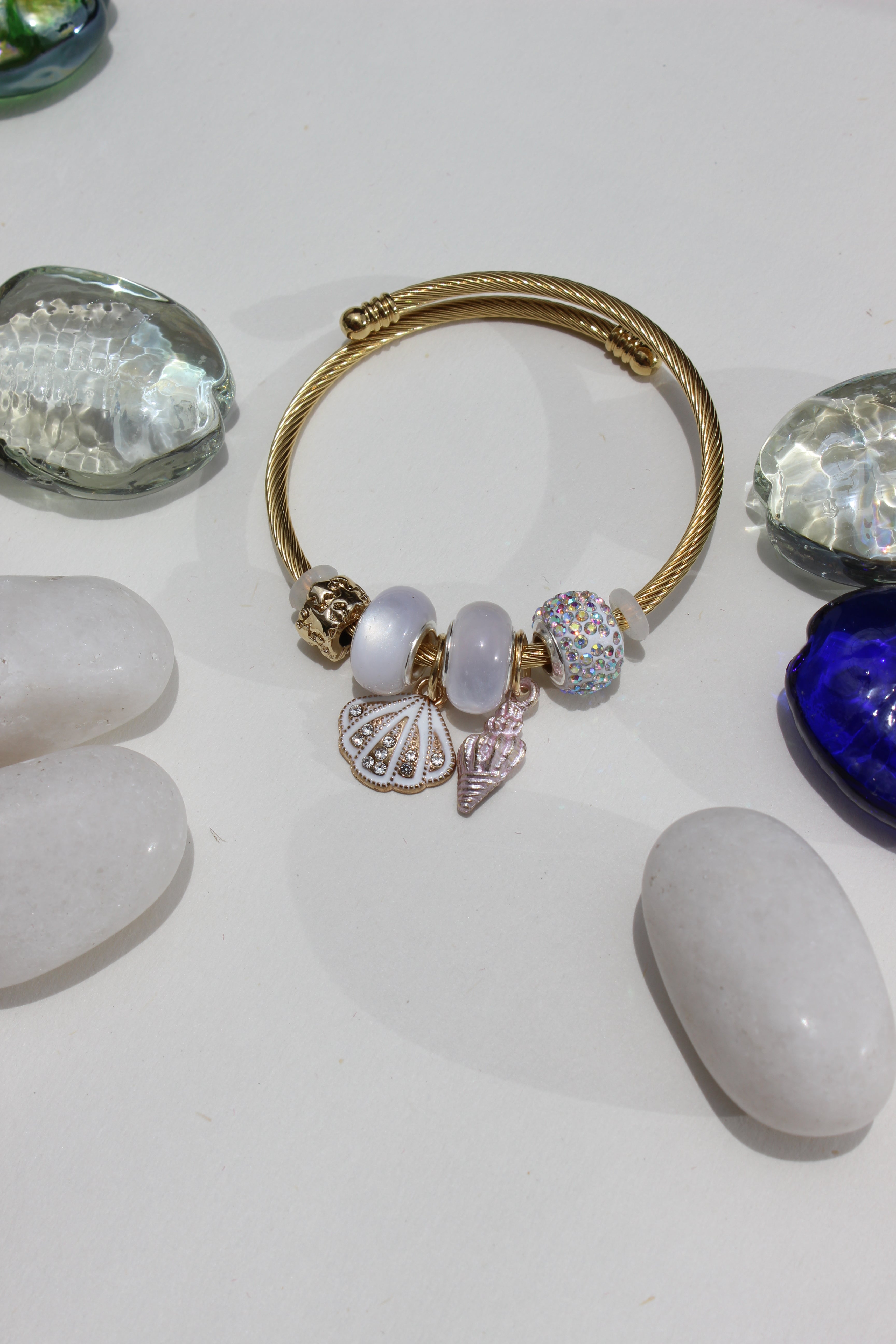 Alba Muse Charms Bracelet with charms on a white surface