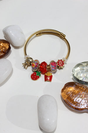 Blazette Charms Bracelet on a white surface