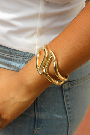 Heavy Petal Bracelet on a wrist with a blurred background