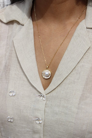 Close-up of a Bound in Pearl Pendant Necklace 