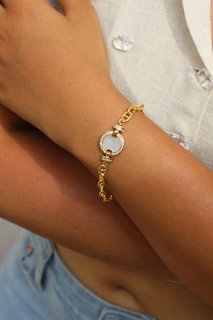 Sea of Light Bracelet with a circular design on a wrist, blurred background