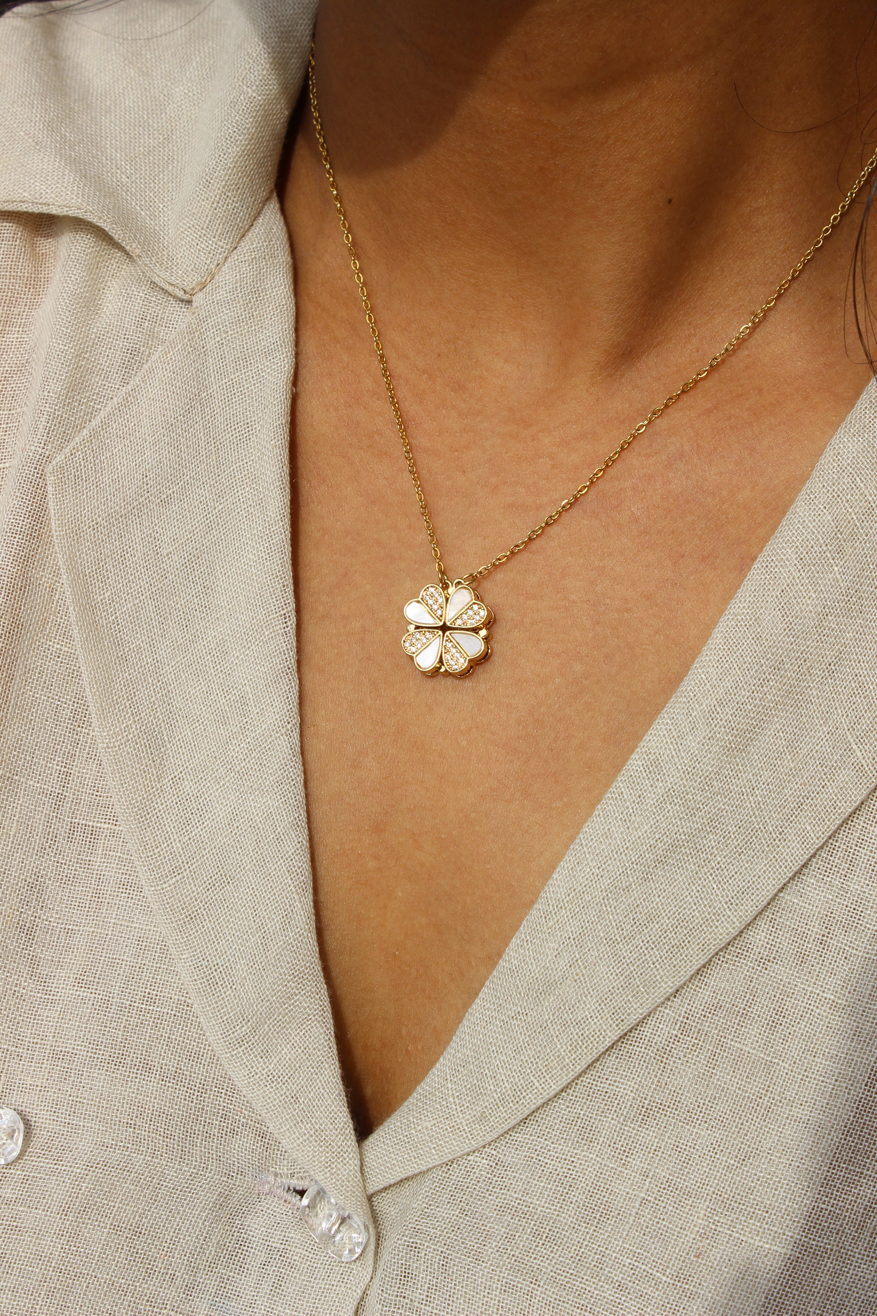 Oyster Petal Pendant Necklace on a model wearing a beige top