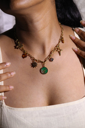 Amberjoy Charms Necklace on a neutral background