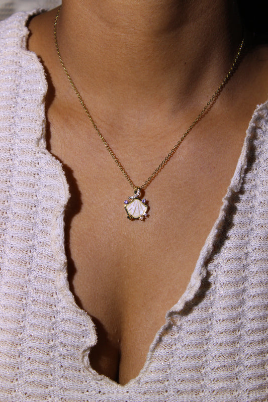 Heir to the Sea Pendant Necklace on a model's neck against a neutral background