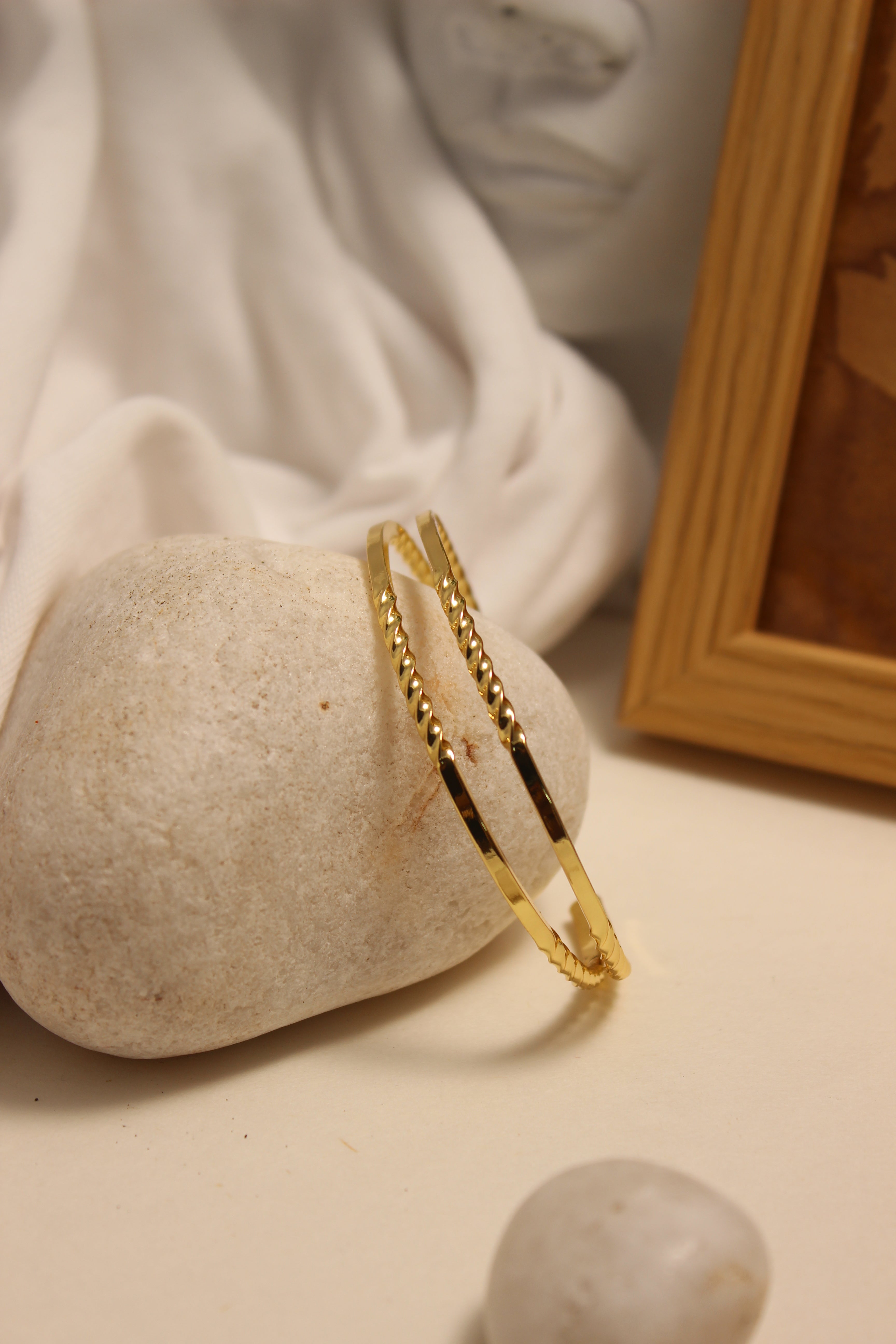 Loom Cuff Bracelet on a stone surface with a soft, warm background