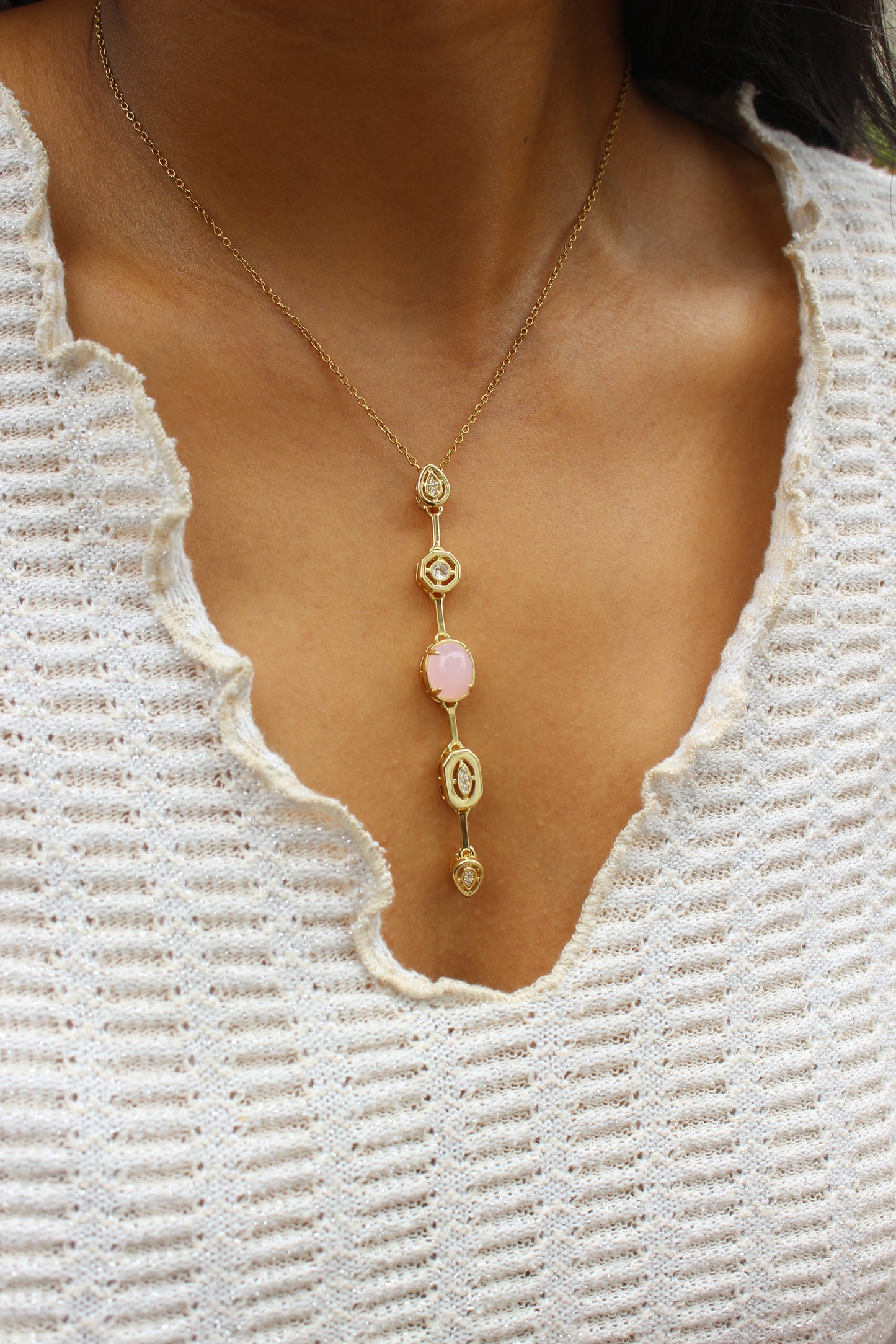 Rosaline Dawn Necklace on a model with white top