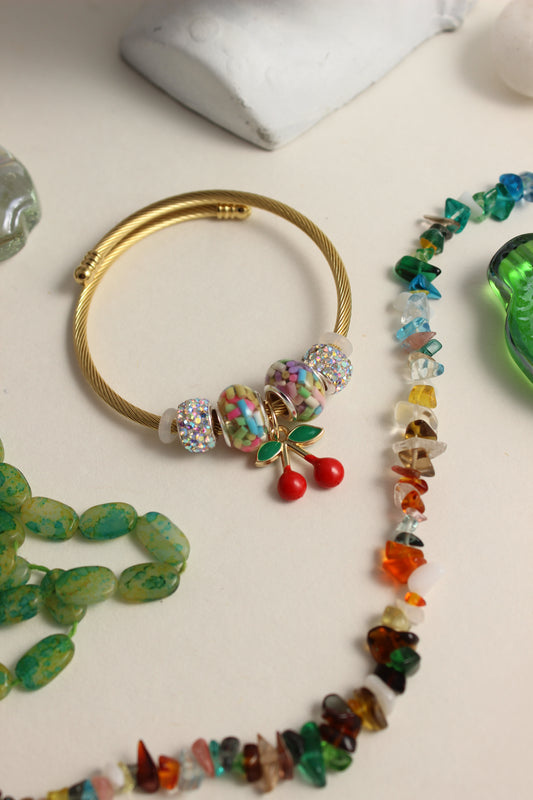Colorful Cherry Fizz Bracelet on a light background