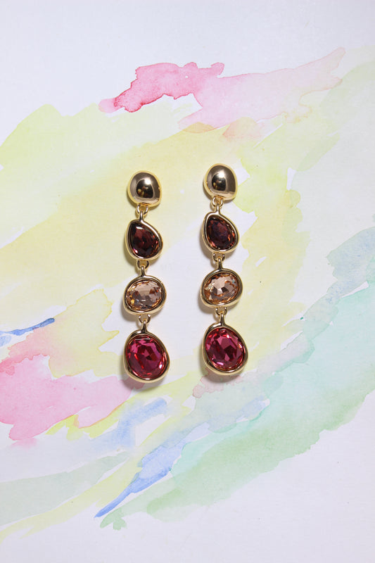 Sienna Bloom Earrings on a color background
