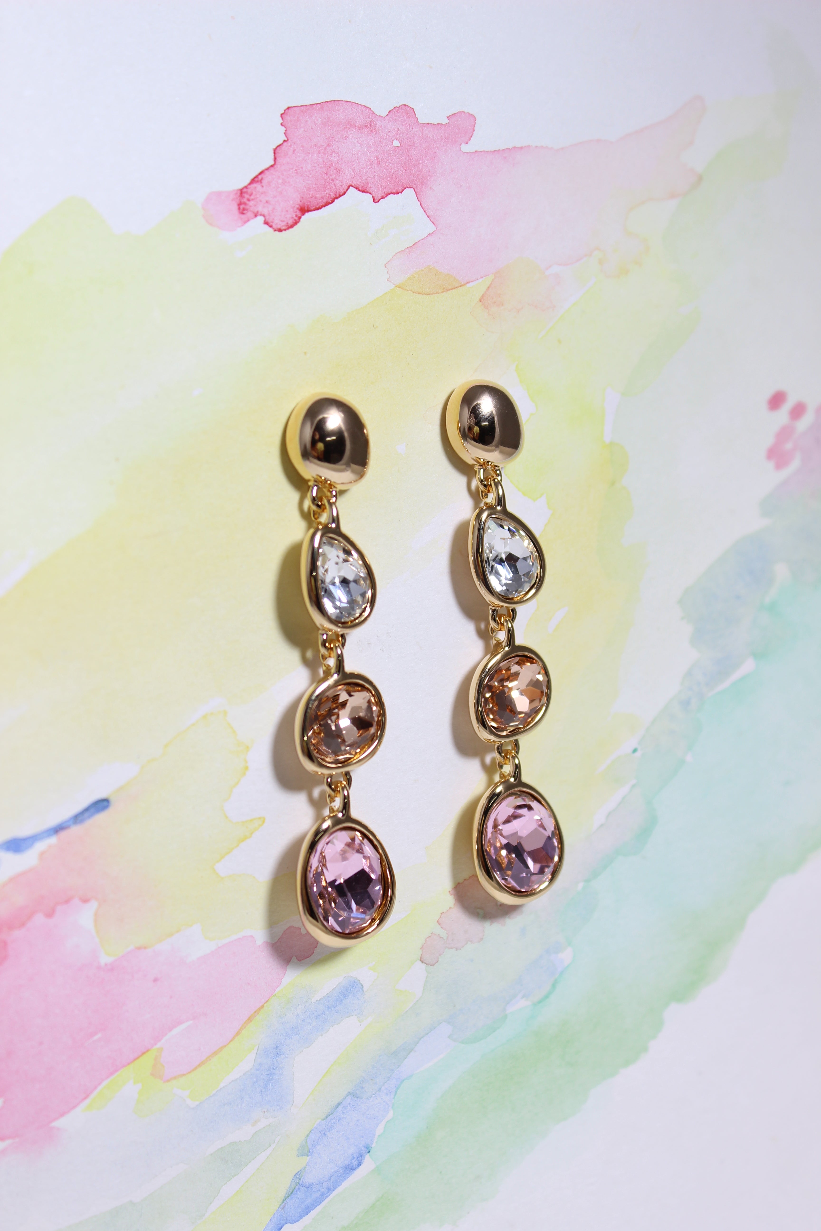 Auric Petals Earrings on a color background