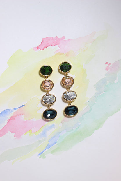 Set of Forest Light Earrings with multicolored gemstones on a watercolor background