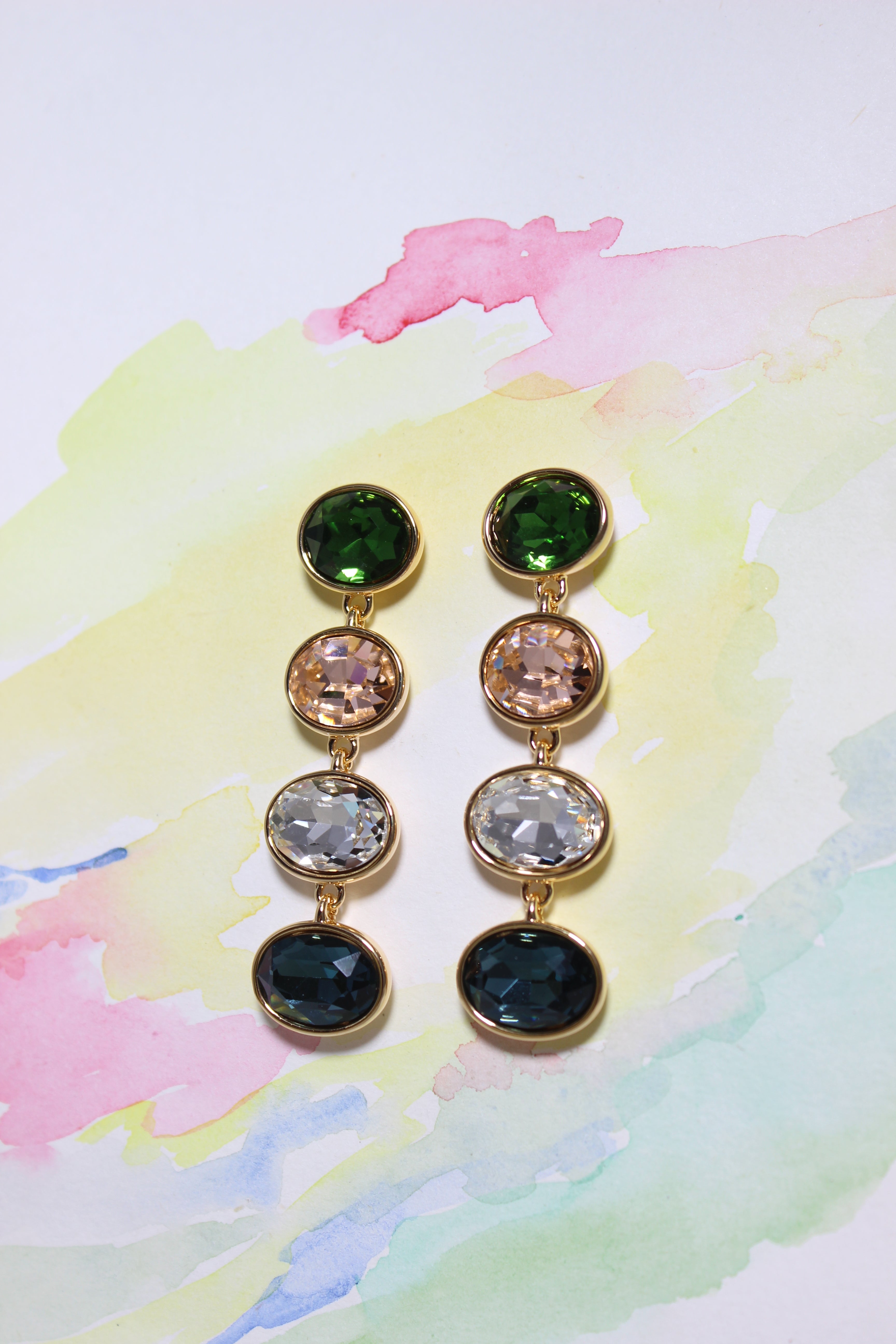 Forest Light Earrings on a watercolor background