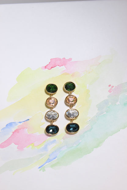 Set of Forest Light Earrings with colored stones on a watercolor background