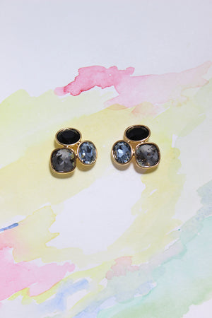 Blue Mirage Earrings on a colorful watercolor background