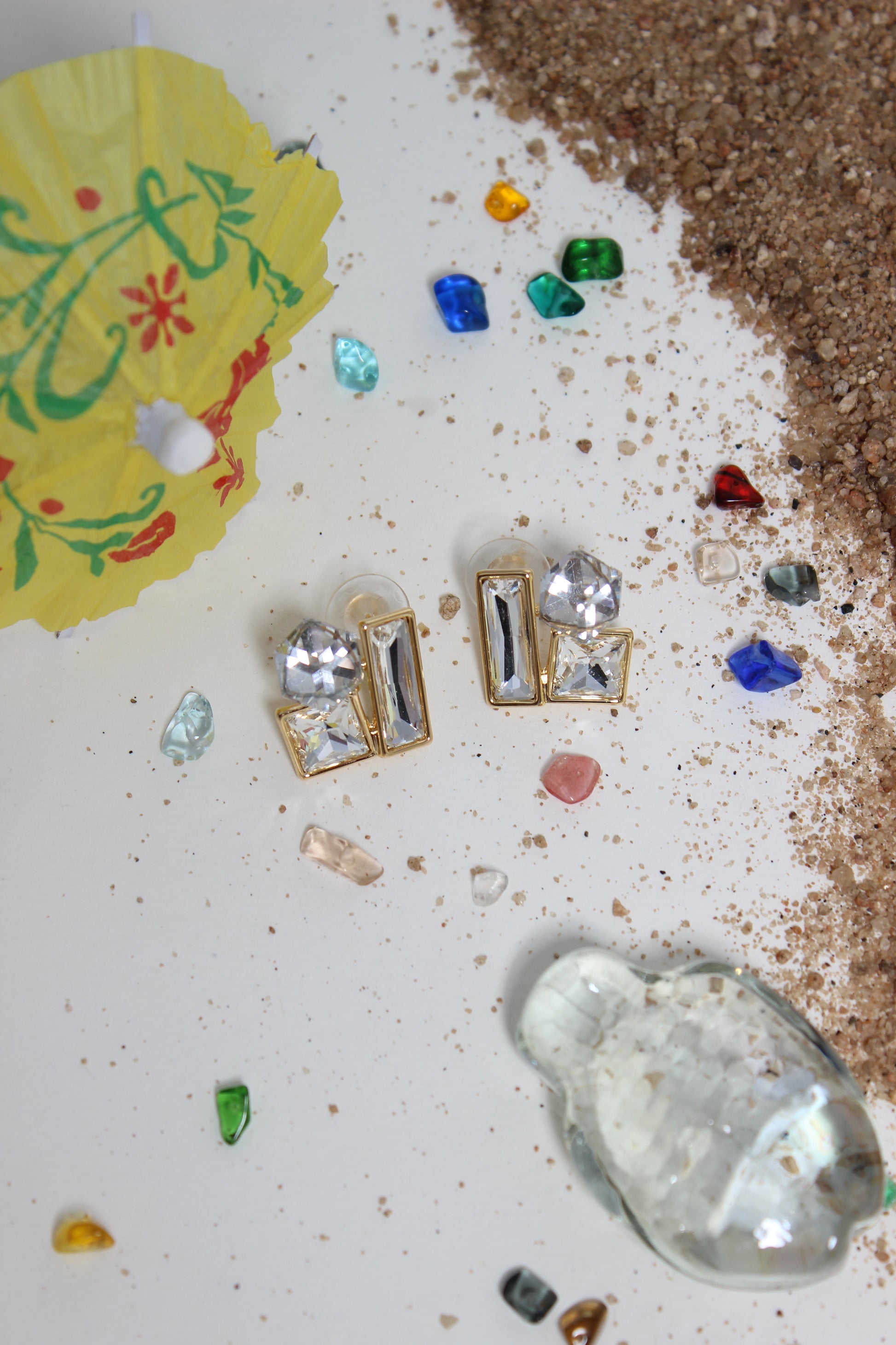 Moonlight Glow Earrings on a textured surface