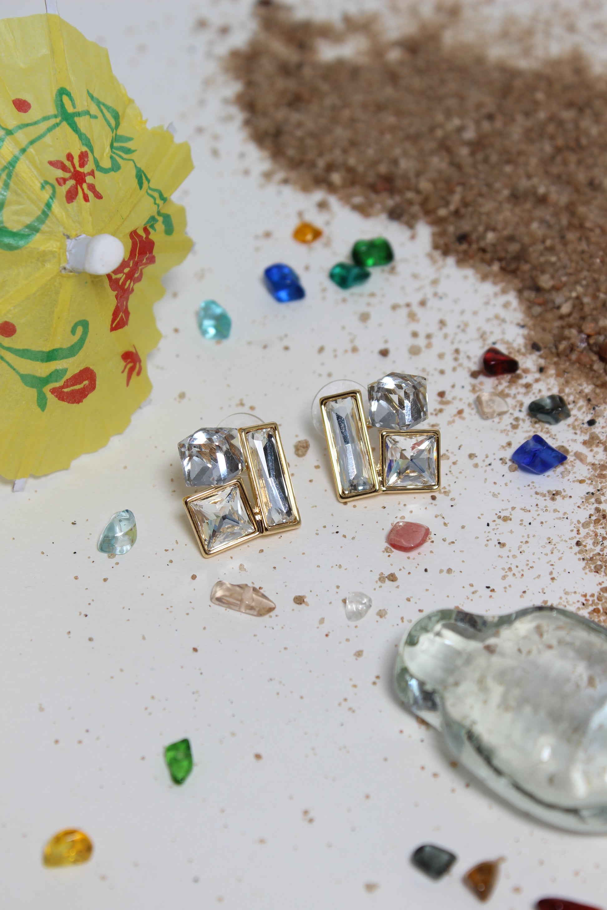 Moonlight Glow Earrings on a textured surface