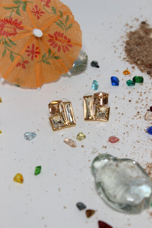 Copper Glow Earrings on a textured surface