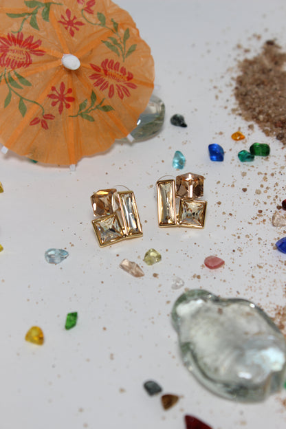 Copper Glow Earrings on a textured surface