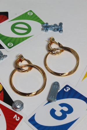 Cosmo Ring Earrings on a card with colorful numbers and symbols