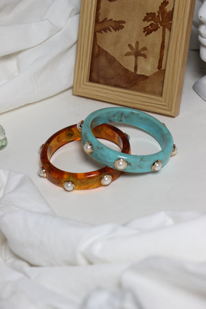 Confetti Stacks Resin Bangles on a white surface