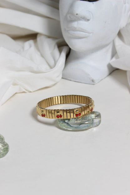 Cherry Twist Bracelet on a white surface