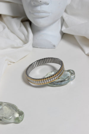 Dual Harmony Bracelet on a white marble bust