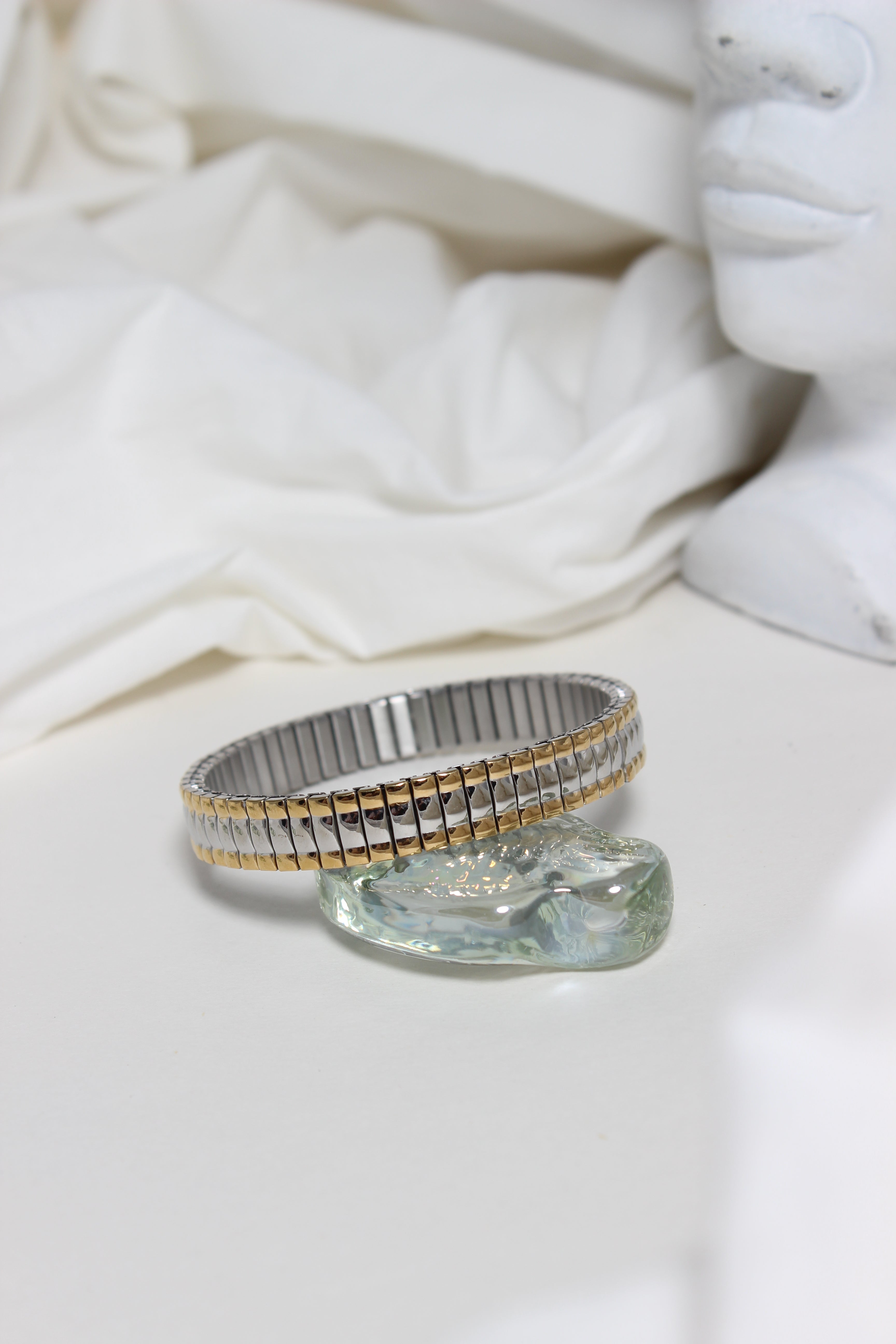 Dual Harmony Bracelet on a white fabric background