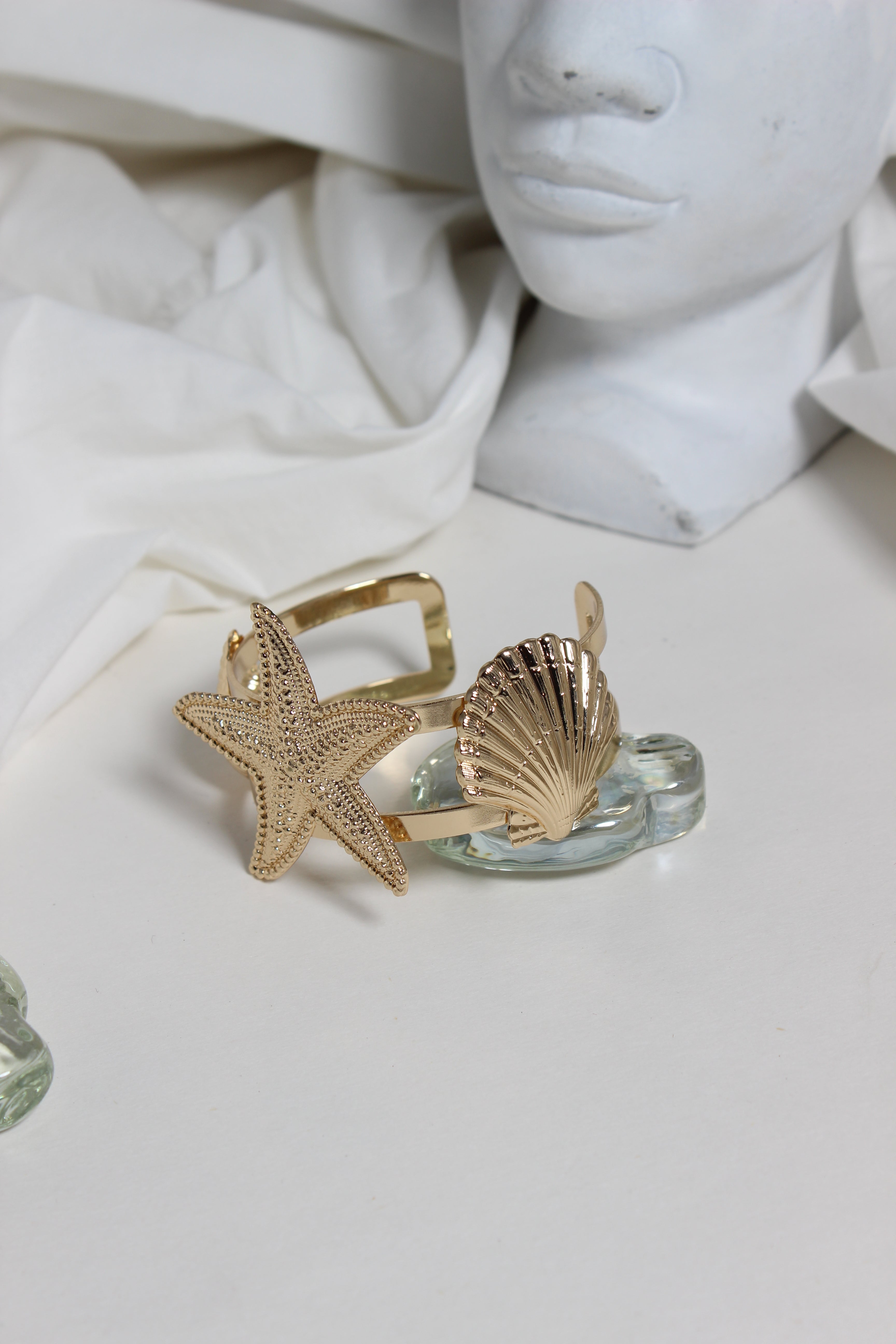 Golden Tide Cuff Bracelet on a light surface