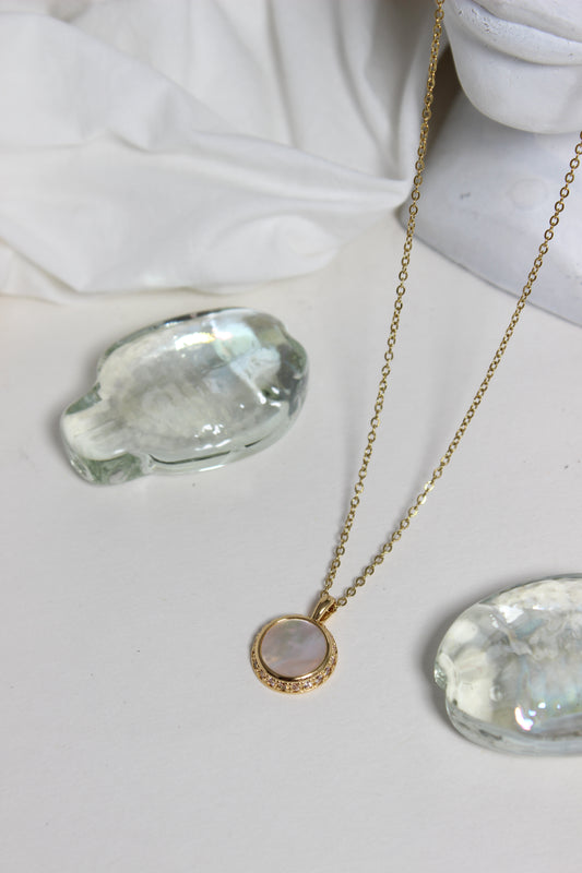 Iridesca Pendant Necklace on a white surface