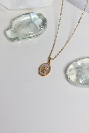 Cuddle Pearl Pendant Necklace on a white surface