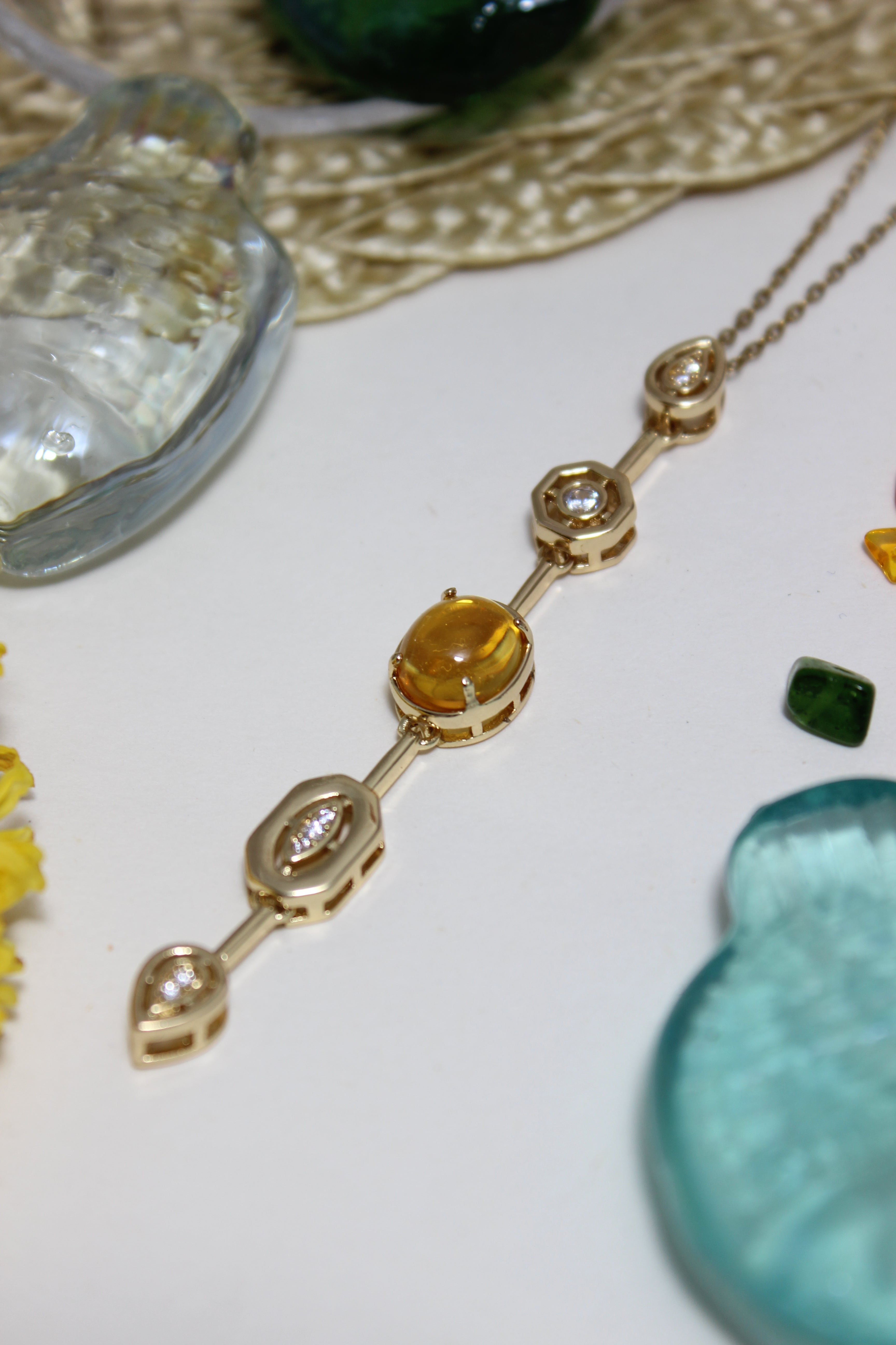 Coralie Necklace on a textured surface