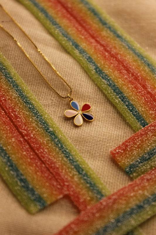 Colorbud Pendant Necklace on a textured surface